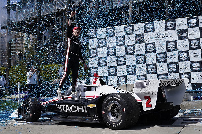 AP photo by Ashley Landis / Team Penske driver Josef Newgarden celebrates after winning Sunday's IndyCar race on the street course in Long Beach, Calif.