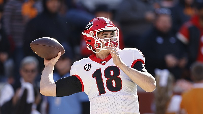 AP file photo by Wade Payne / Quarterback JT Daniels, who was 7-0 as a starter in two seasons at Georgia, will transfer to West Virginia. Daniels put his name in the NCAA transfer portal in January but did not announce his transfer destination until Wednesday.