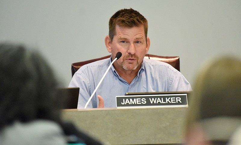 Staff File Photo By Matt Hamilton / Newly appointed Hamilton County Board of Education member James Walker questions an administration staff member during a school board meeting last August.