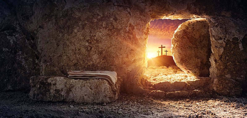 Resurrection of Jesus Christ: Empty tomb at sunrise with crosses in background. Getty Images/iStock/RomoloTavani