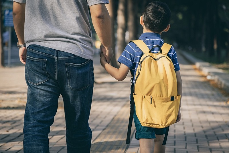 Father and son going to kindergarten - stock photo parent child school tile / Getty Images

