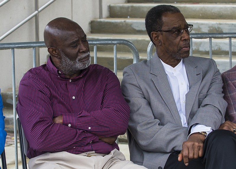 AP photo by Vasha Hunt / Wilbur Jackson, left, and John Mitchell listen during Saturday's ceremony for the unveiling a plaque honoring their roles for the University of Alabama football program. Jackson was the first Black scholarship player for the Crimson Tide, and Mitchell was the team's first Black player to appear in a game.