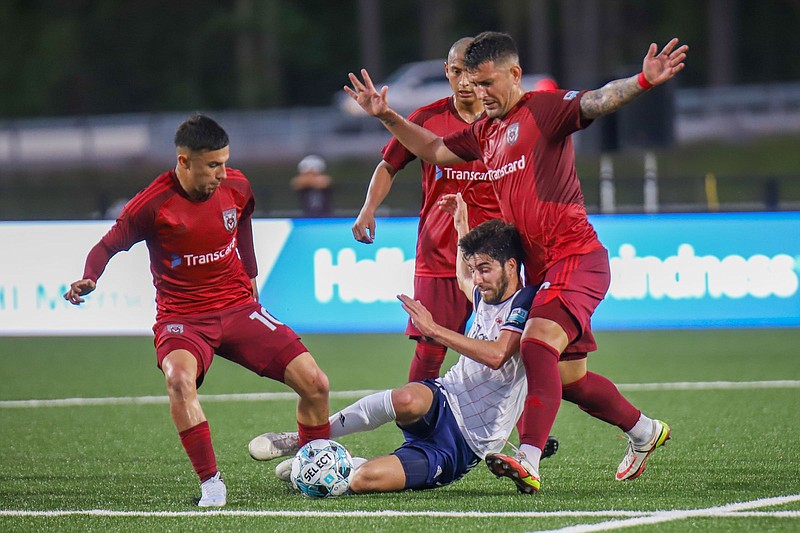 Staff photo by Olivia Ross  / The Chattanooga Red Wolves' Jose Carrera-Garcia, left, takes possession of the ball during Saturday night's USL League One match against the Richmond Kickers at CHI Memorial Stadium in East Ridge.