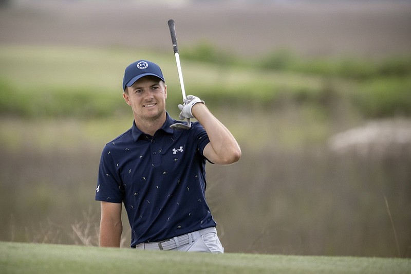 Jordan Spieth celebrates from the front bunker after chipping in at the 18th hole during the final round of the RBC Heritage golf tournament, Sunday, April 17, 2022, in Hilton Head Island, S.C. (AP Photo/Stephen B. Morton)

