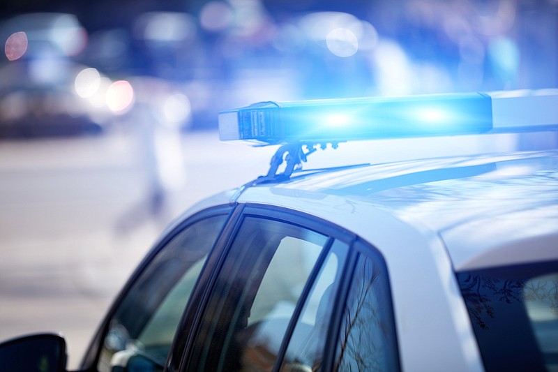 Police car with blue lights. / Getty Images