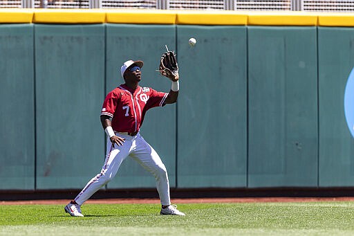 Oklahoma left fielder Kendall Pettis (7) makes a catch for an out against Texas A&M in the sixth inning during an NCAA College World Series baseball game Wednesday, June 22, 2022, in Omaha, Neb. (AP Photo/John Peterson)