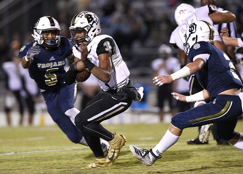 Staff Photo by Robin Rudd/  Bradley quarterback Javin Burke (3) scrambles for a first down.  The Soddy-Daisy Trojans hosted the Bradley Central Bears in a TSSAA football game on October 24, 2019.