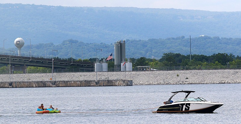 Staff File Photo / A boat hauls a couple of towable tubes behind it on Chickamauga Lake in 2019 in Chattanooga.