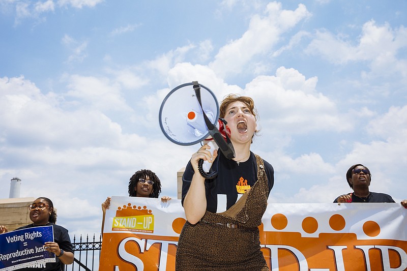 Photo by Kendrick Brinson of The New York Times / Abortion rights activists protest outside the Georgia State Capitol in Atlanta on Friday, June 24, 2022. "This is why I have come to fully, religiously believe that if this county is to be saved, it will be women who do the saving," writes New York Times columnist Charles M. Blow.