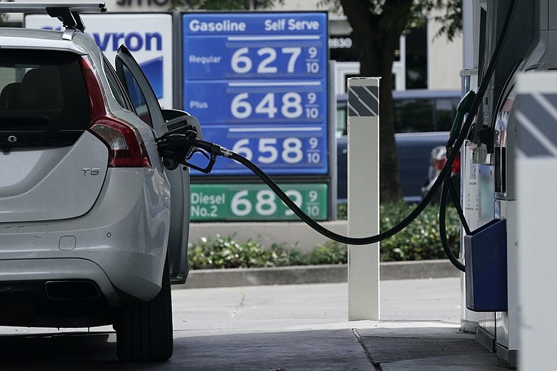 FILE— Gas is advertised for more than $6 per gallon at a gas station in Sacramento, Calif., Friday, May 27, 2022. Many California households could soon get help to pay for the state's record-high gas prices. Most California households would get up to $1,050 from the government to help them put the nation's most expensive gasoline in their cars, part of a relief package in the state's record-setting operating budget that lawmakers are scheduled to approve later this week. (AP Photo/Rich Pedroncelli, File)