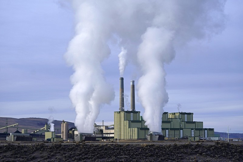 FILE - Steam billows from a coal-fired power plant Nov. 18, 2021, in Craig, Colo. The Supreme Court on Thursday, June 30, 2022, limited how the nation's main anti-air pollution law can be used to reduce carbon dioxide emissions from power plants. By a 6-3 vote, with conservatives in the majority, the court said that the Clean Air Act does not give the Environmental Protection Agency broad authority to regulate greenhouse gas emissions from power plants that contribute to global warming. (AP Photo/Rick Bowmer, File)

