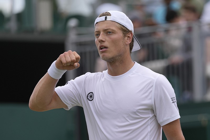 AP photo by Alastair Grant / Tim van Rijthoven celebrates after winning the first set against Nikoloz Basilashvili in a third-round match Friday at Wimbledon.