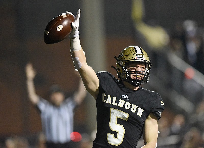 Staff photo by Matt Hamilton / Calhoun High School receiver Cole Speer celebrates after scoring a touchdown against visiting Blessed Trinity in a GHSA Class AAAAA semifinal last December. The University of Georgia's prospect camp led to Speer eventually signing with the Bulldogs, and there are a variety of football camps that help prep players get noticed by college coaches.