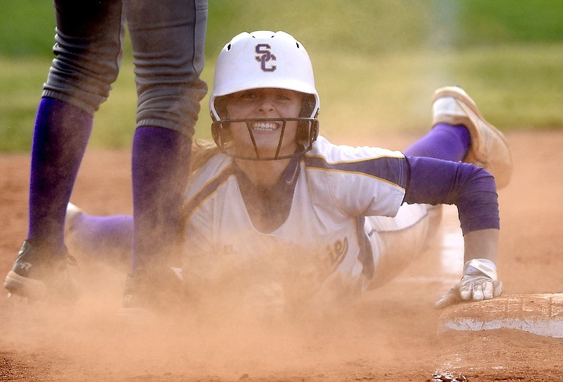 Staff photo by Robin Rudd / Sequatchie County's Ella Edgmon smiles as she is safe at third base with a three-run triple during a home game against Marion County in May 2019. She was a freshman standout this spring for Georgia Tech, and younger sister Addy will play college softball next year for Western Kentucky.