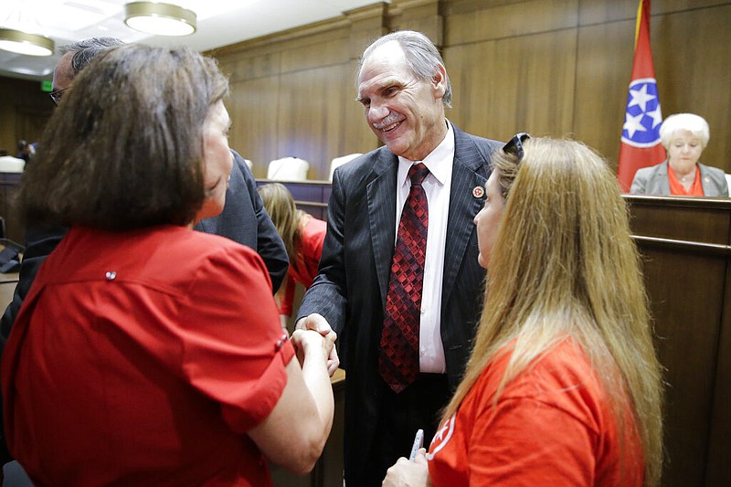 Sen. Mark Pody, R-Lebanon, talks with people attending a Senate hearing to discuss a fetal heartbeat abortion ban, or possibly something more restrictive in 2019, in Nashville. (AP Photo/Mark Humphrey)