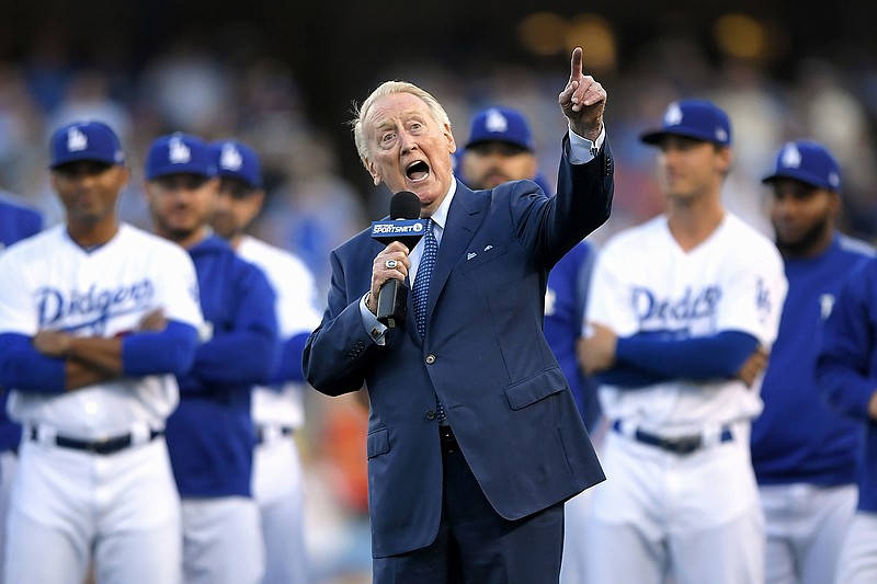 AP photo by Mark J. Terrill / Legendary broadcaster Vin Scully speaks during his induction into the Los Angeles Dodgers Ring of Honor before a home game against the San Francisco Giants in May 2017.