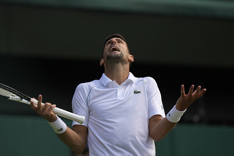 Serbia's Novak Djokovic reacts as he plays Italy's Jannik Sinner in a men's singles quarterfinal match on Tuesday during Wimbledon.