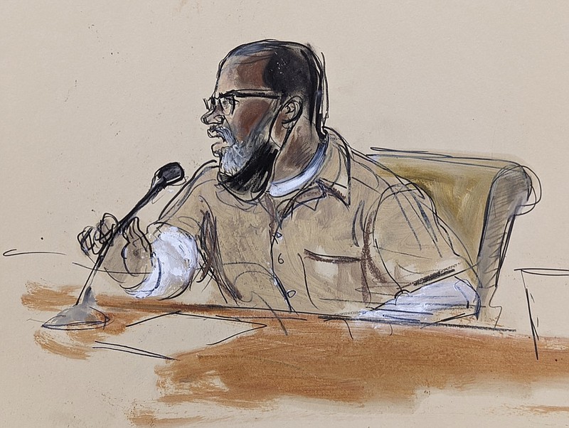 In this courtroom sketch, R. Kelly briefly addresses Judge Ann Donnelly during his sentencing in federal court, June 29, 2022, in New York. (AP Photo/Elizabeth Williams, File)