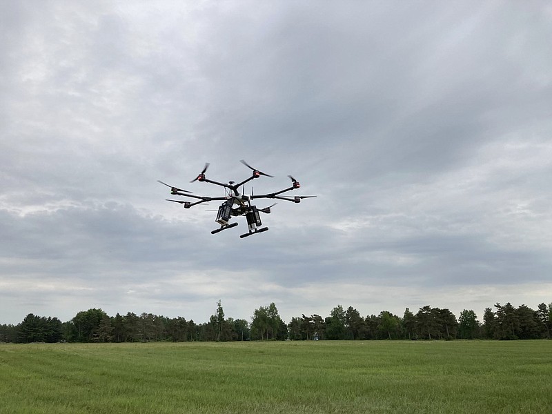 A drone flies at one of the Federal Aviation Administration's designated drone testing sites run by nonprofit Northeast UAS Airspace Integration Research Alliance Inc., at Griffiss International Airport in Rome, N.Y., on June 11, 2021. The FAA is working to relax some aviation rules to allow some drone operators to fly their machines out of their line of sight. (AP Photo/Matt O'Brien)