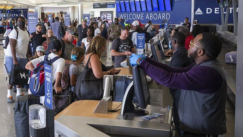 Passengers check in for Delta flights in the domestic terminal of Hartsfield-Jackson Atlanta International Airport on Wednesday, June 29, 2022. (Chris Day/The Atlanta Journal-Constitution)