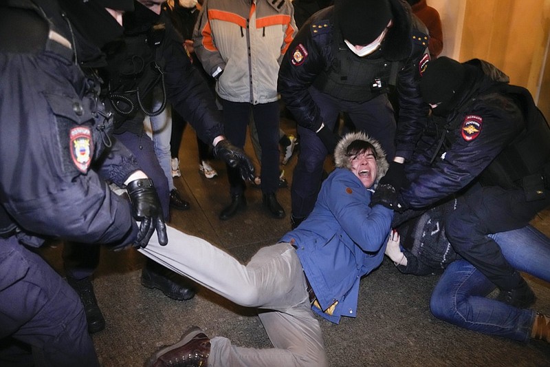 FILE - Police officers detain demonstrators in St. Petersburg, Russia, Feb. 24, 2022. When President Vladimir Putin sent troops to Ukraine, a massive wave of outrage and anti-war sentiment swept Russia. The Kremlin in response insisted that what it called a "special military operation" in Ukraine attracted overwhelming public support, and moved swiftly to suppress any dissent. (AP Photo, File)

