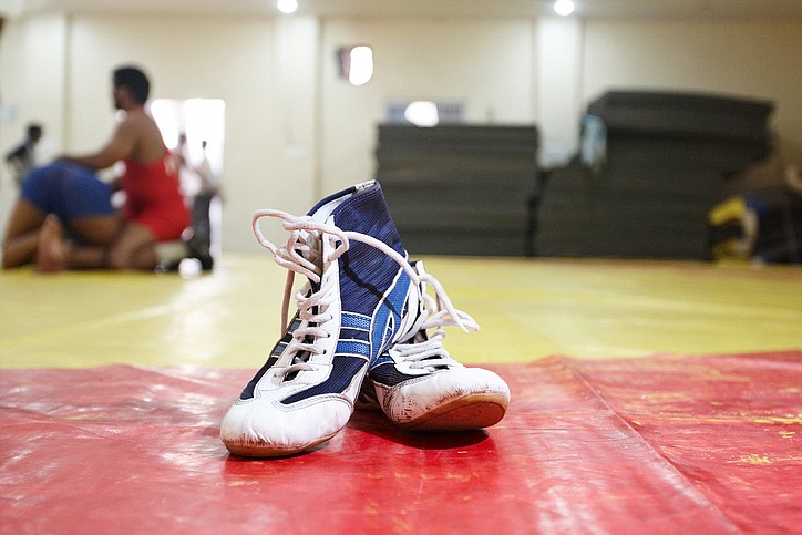 Wrestling boots at the gym, tile. / Getty Images