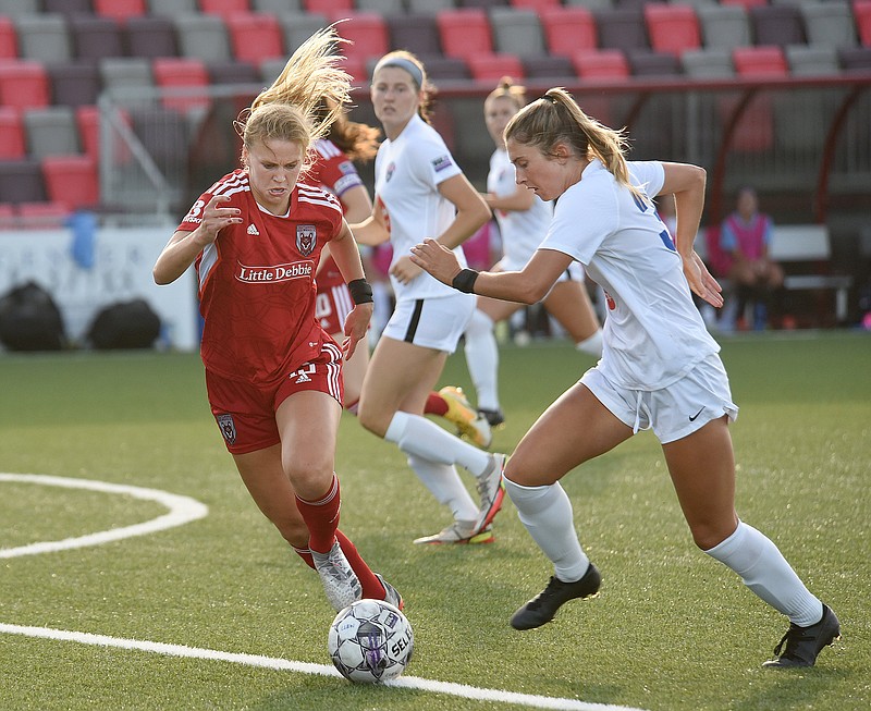 Staff photo by Matt Hamilton / Chattanooga Lady Red Wolves midfielder Mackenzie Smith, left, defends during a USL W League match against Tennessee SC on June 17 at CHI Memorial Stadium in East Ridge.