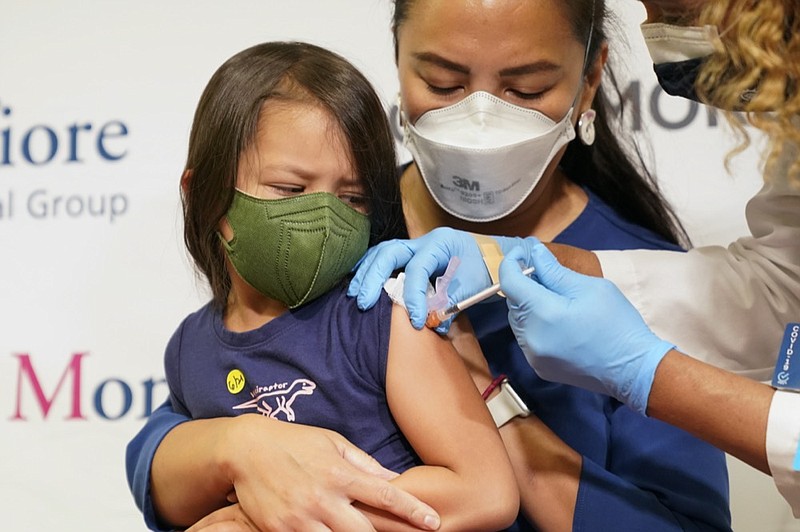 Maria Assisi holds her daughter Mia, 4, as registered nurse Margie Rodriguez administers the first dose of the Moderna COVID-19 vaccine for children 6 months through 5 years old, June 21, 2022, at Montefiore Medical Group in the Bronx borough of New York. (AP Photo/Mary Altaffer, File)



