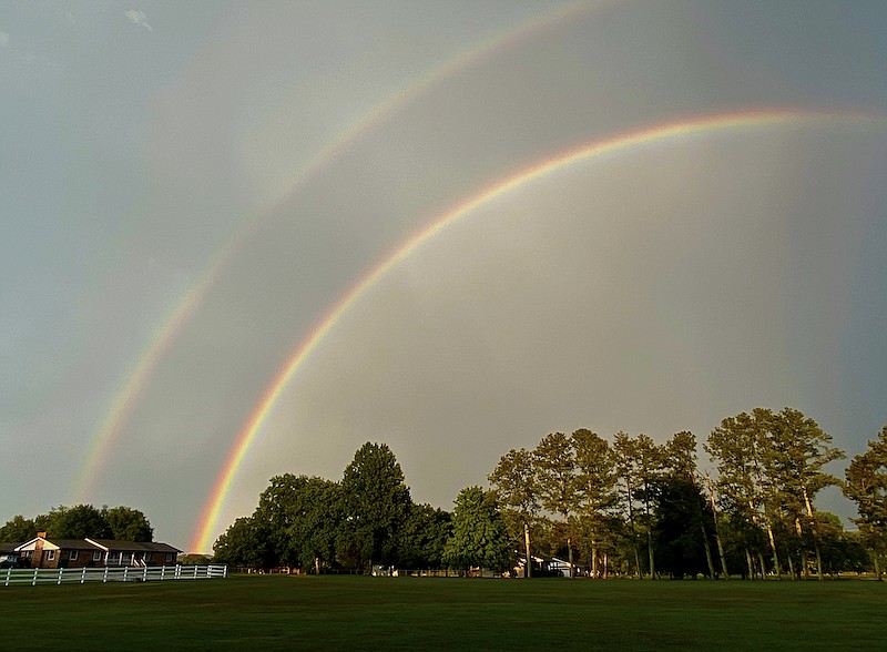 Staff Photo by Robin Rudd / Looking like a firework shot into the air, a double rainbow courses across the sky on Friday evening in East Brainerd. 