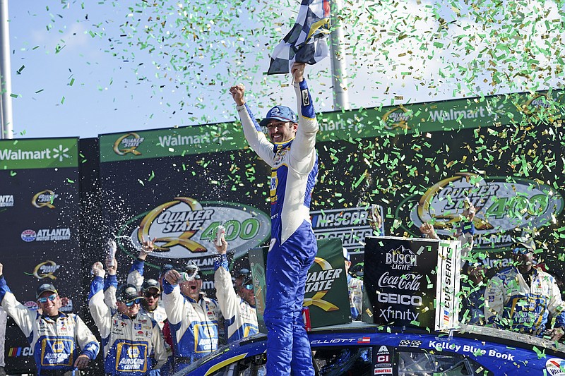 AP photo by John Bazemore / Georgia native Chase Elliott celebrates in victory lane at Atlanta Motor Speedway after winning Sunday's NASCAR Cup Series race. Elliott finally won a Cup Series race at his home track on his ninth attempt.