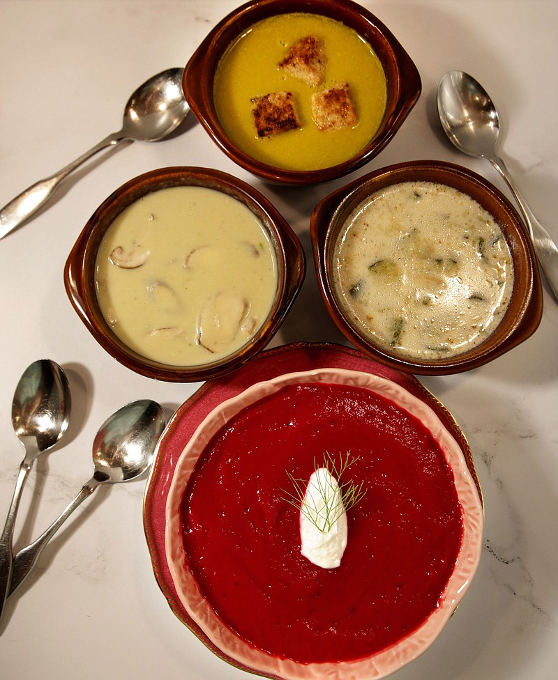 A selection of summer soups, clockwise from top, Sweet Pea, Cream of Zucchini and Almond, Beet-Fennel-Ginger and Asparagus and Shiitake Mushroom. / Hillary Levin/St. Louis Post Dispatch/TNS