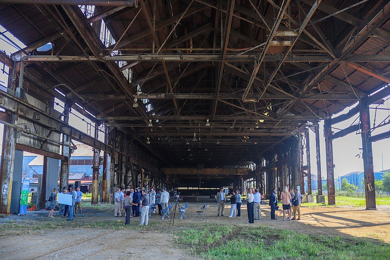 Staff photo by Olivia Ross / EPA and Chattanooga officials gathered July 6 to announce a grant that will go toward cleaning up the proposed Chattanooga Lookouts stadium site.