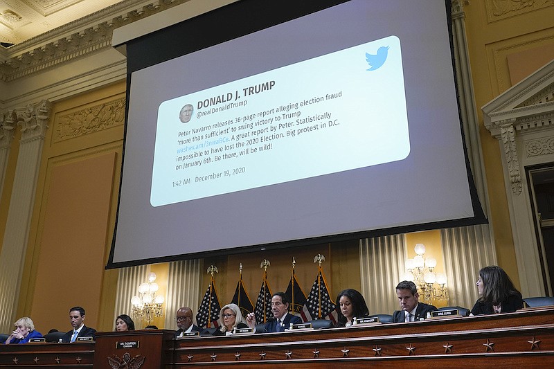 A tweet from former President Donald Trump is shown as the House select committee investigating the Jan. 6 attack on the U.S. Capitol holds a hearing at the Capitol in Washington, Tuesday, July 12, 2022. (AP Photo/J. Scott Applewhite)