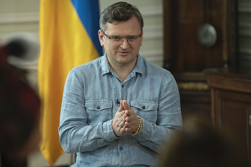 Ukrainian Foreign Minister Dmytro Kuleba speaks during his interview to The Associated Press in Kyiv, Ukraine, Tuesday, July 12, 2022. Ukraine's foreign minister says grain exports from his country's ports won't resume without security guarantees for ship owners, cargo owners and Ukraine as an independent nation.Military officials from Russia and Ukraine were set to hold their governments' first face-to-face talks in months Wednesday during a session in Istanbul devoted to a United Nations plan to export blocked Ukrainian grain to world markets through the Black Sea. (AP Photo/Andrew Kravchenko)