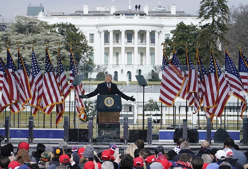 With the White House in the background, President Donald Trump speaks at a rally in Washington, Jan. 6, 2021. (AP Photo/Jacquelyn Martin, File)