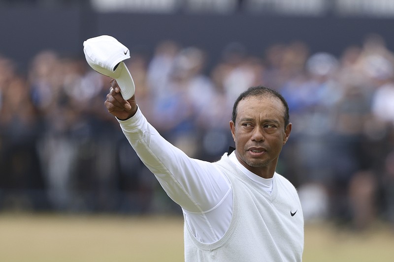 AP photo by Peter Morrison / Tiger Woods acknowledges the crowd at the end of his second round Friday on the Old Course at St. Andrews, Scotland. Woods shot a 75 and missed the cut by nine strokes in what could be his final British Open at St. Andrews.