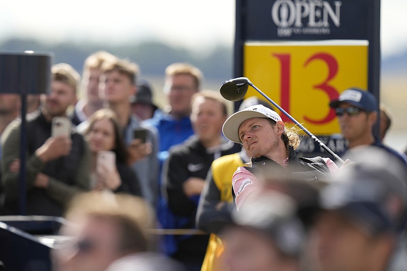 AP photo by Alastair Grant / Cameron Smith plays from the 13th tee during Friday's second round of the British Open on the Old Course at St. Andrews. Smith shot a 64 and had a two-shot advantage over first-round leader Cameron Young.