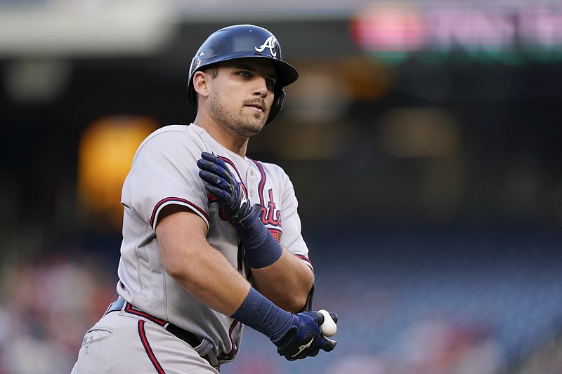 AP photo by Patrick Semansky / Atlanta Braves third baseman Austin Riley gestures to his team's dugout as he rounds the bases after hitting a two-run homer in the first inning of Friday night's game against the Washington Nationals.