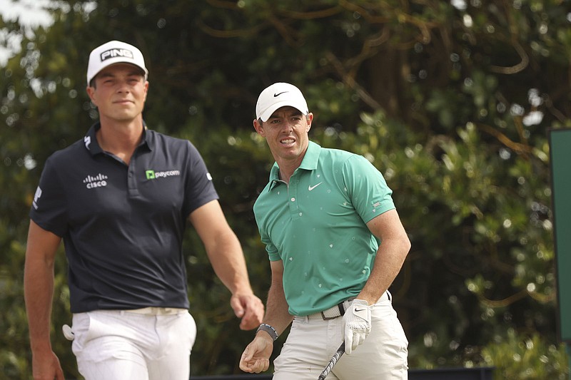 AP photo by Peter Morrison / Rory McIlroy, right, and Viktor Hovland each shot a 66 on Saturday and shared a four-stroke lead entering the final round of the British Open on the Old Course at St. Andrews, Scotland.