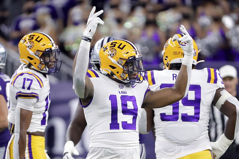 The Associated Press / LSU linebacker Mike Jones Jr. (19) tries to rev up the crowd between plays during the first half of the Texas Bowl NCAA college football game against Kansas State Tuesday, Jan. 4, 2022, in Houston.
