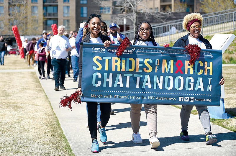 Staff Photo by Matt Hamilton / From left, Myia Favors, Sariah Deloney and Aisha McGee lead the Strides of March event sponsored by Cempa Community Care at Renaissance Park.