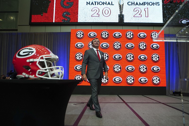 Georgia head coach Kirby Smart steps to the podium to speak during NCAA college football Southeastern Conference Media Days, Wednesday, July 20, 2022, in Atlanta. (AP Photo/John Bazemore)