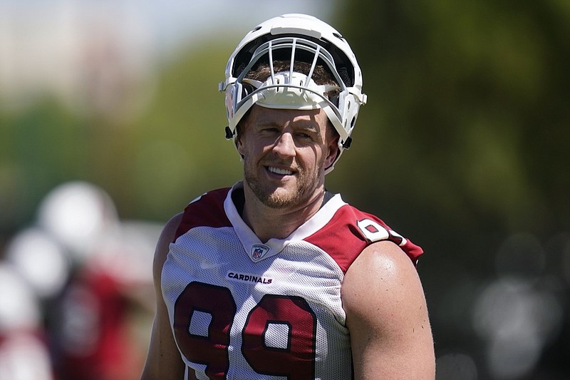 Arizona Cardinals defensive lineman J.J. Watt pauses on the practice field as he takes part in drills at the NFL football team's practice facility Tuesday, June 14, 2022, in Tempe, Ariz. (AP Photo/Ross D. Franklin)