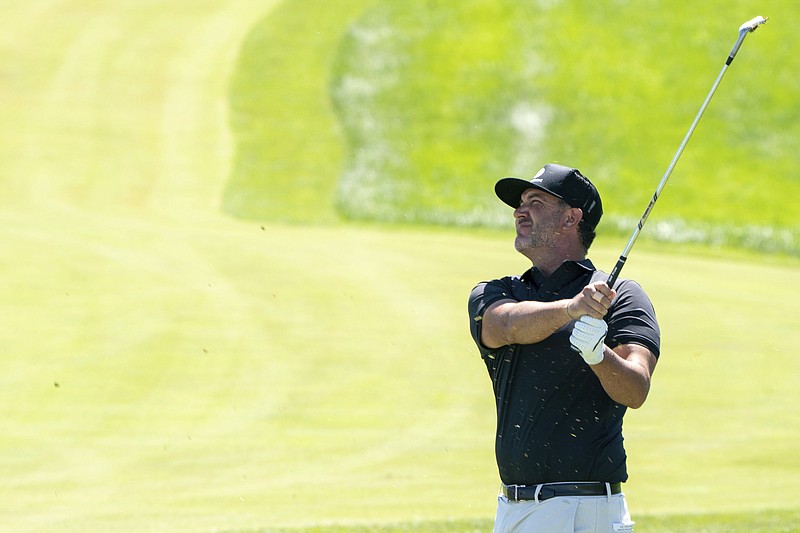 Scott Piercy hits the ball at the 18th hole during the opening round of the 3M Open golf tournament at the Tournament Players Club in Blaine, Minn., Thursday, July 21, 2022. (Erica Dischino/Star Tribune via AP)