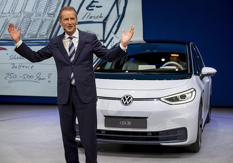 FILE - In this Monday, Sept. 9, 2019, file photo, CEO of Volkswagen Herbert Diess introduces the new VW ID.3 at the IAA Auto Show in Frankfurt, Germany. Volkswagen has announced that the CEO of the German automaker is stepping down. The company said Friday that Herbert Diess will depart as of Sept. 1 "by mutual consent" with the board. His contract was set to expire in 2025. (AP Photo/Michael Probst, file)