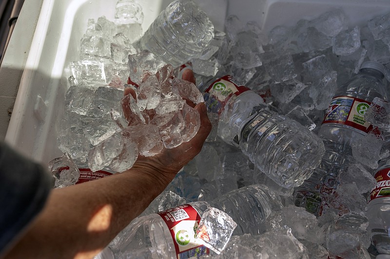 Photo by Nick Oxford of The New York Times / Ice and bottled water is distributed to homeless people in Oklahoma City as temperatures reach 110 degrees on Tuesday, July 19, 2022. About 100 million Americans from California to New England are sweating through heat advisories and warnings from the National Weather Service on Wednesday, with a brutal heat wave across the central part of the country showing no signs of letting up.