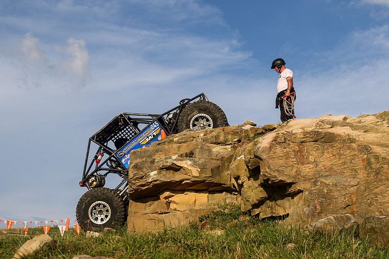 Staff photo by Olivia Ross / Rich Earnhardt and guide Cam Beasley work to make it up a large incline on Saturday. The World Extreme Rock Crawling (W.E. Rock) Eastern Series Round 3 shows off uniquely built vehicles facing extreme obstacles in Dayton, TN.