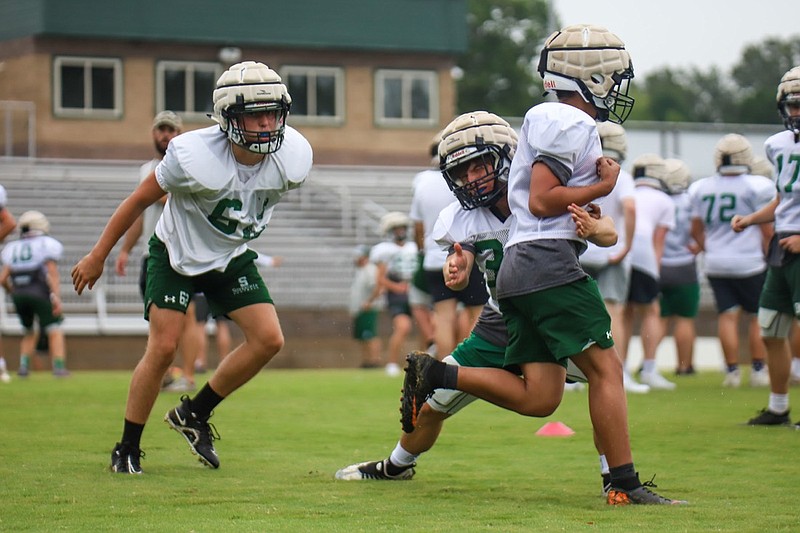 Staff photo by Olivia Ross  / Silverdale Baptist Academy practices early Monday morning on July 25, 2022. Today is the first day that high school prep teams in Tennessee are able to practice in full pads. 