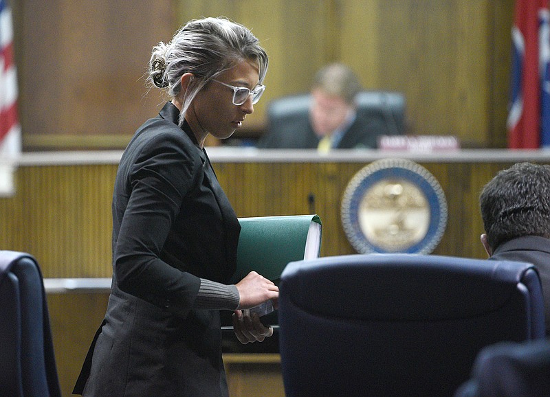 Staff Photo by Matt Hamilton / Brandi Giannunzio stands to leave the courtroom at Hamilton County Criminal Court on Monday.