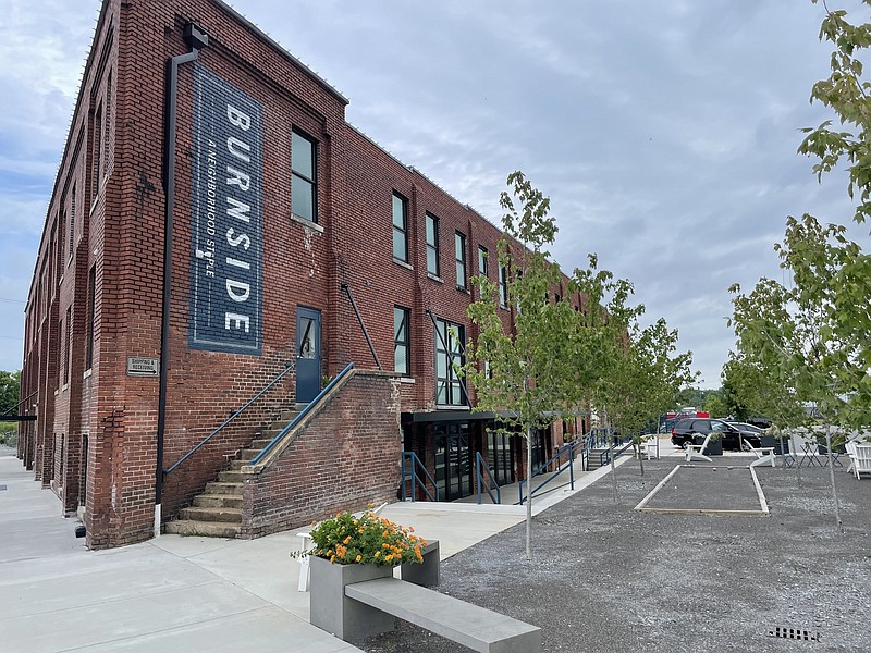 Staff Photo by Dave Flessner / The century-old warehouse that once housed the Andrews Paper Co., shown Friday, has been converted to apartments, commercial space and a No. 10 Steakhouse. The Nashville-based Material Ventures bought Burnside in June.